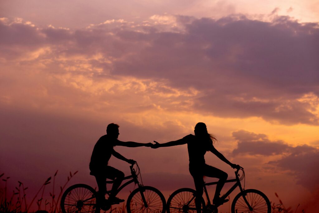 Couple riding bikes together
