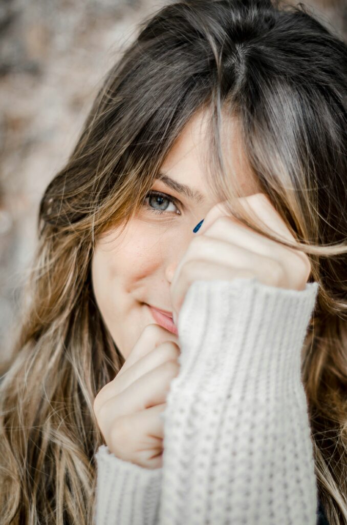 shy girl hiding face